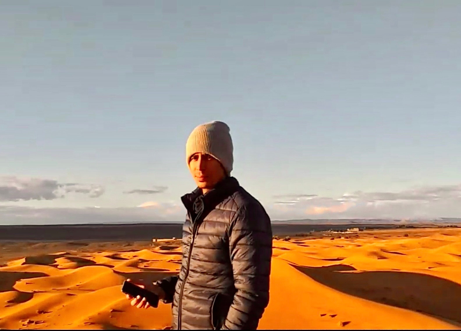 Hussain in the Sahara desert at golden hour